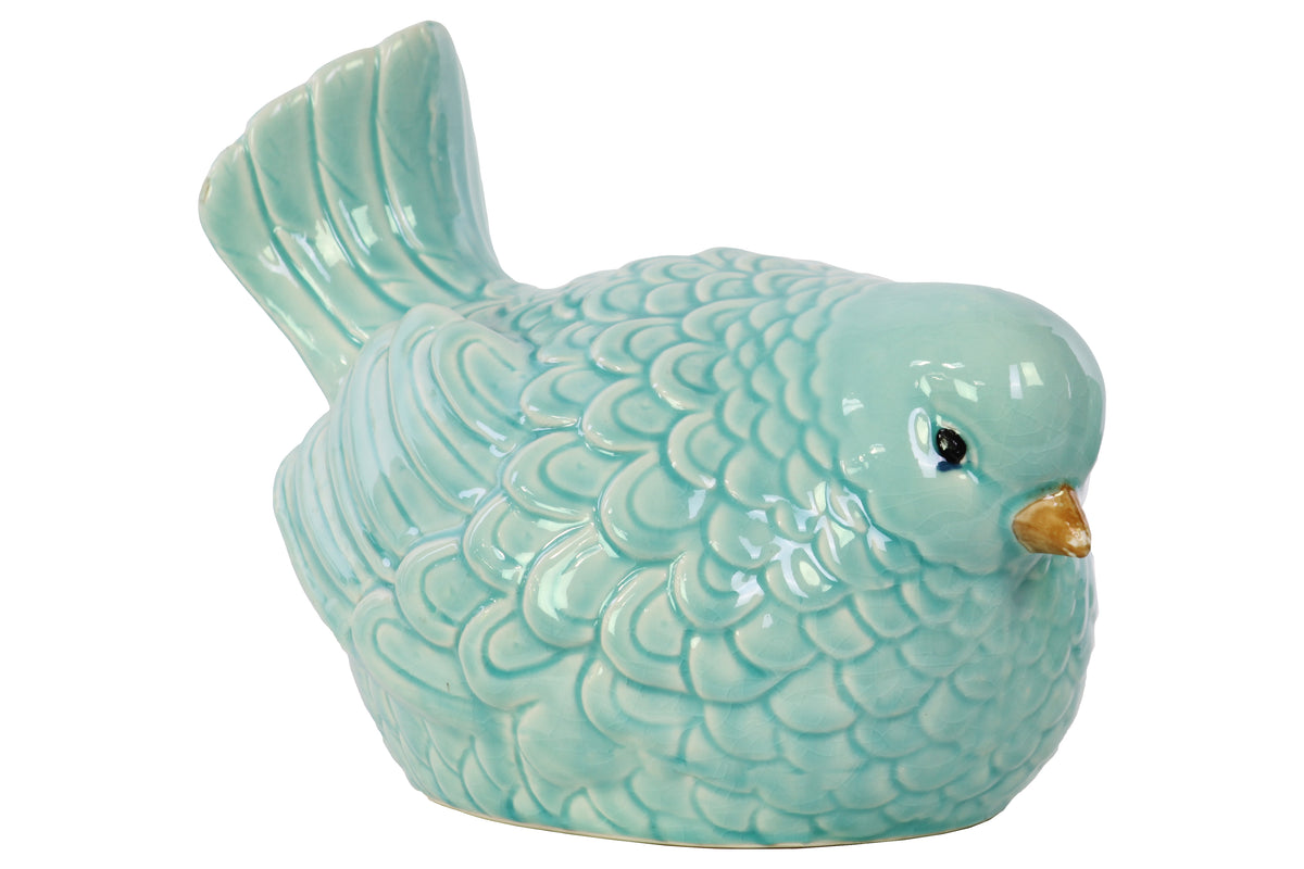 A glossy finish porcelain figurine of a teal blue bird.