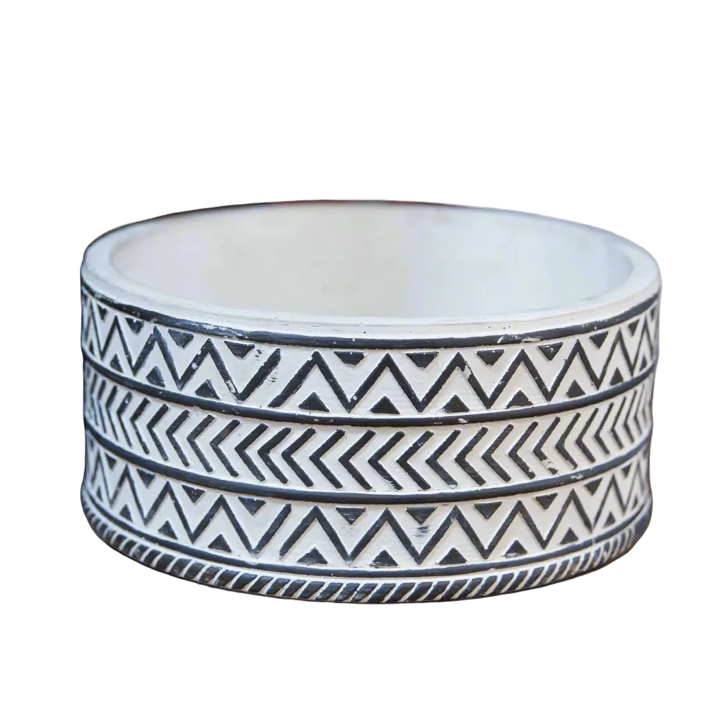 Ceramic bowl with black and white geometric pattern on a white background