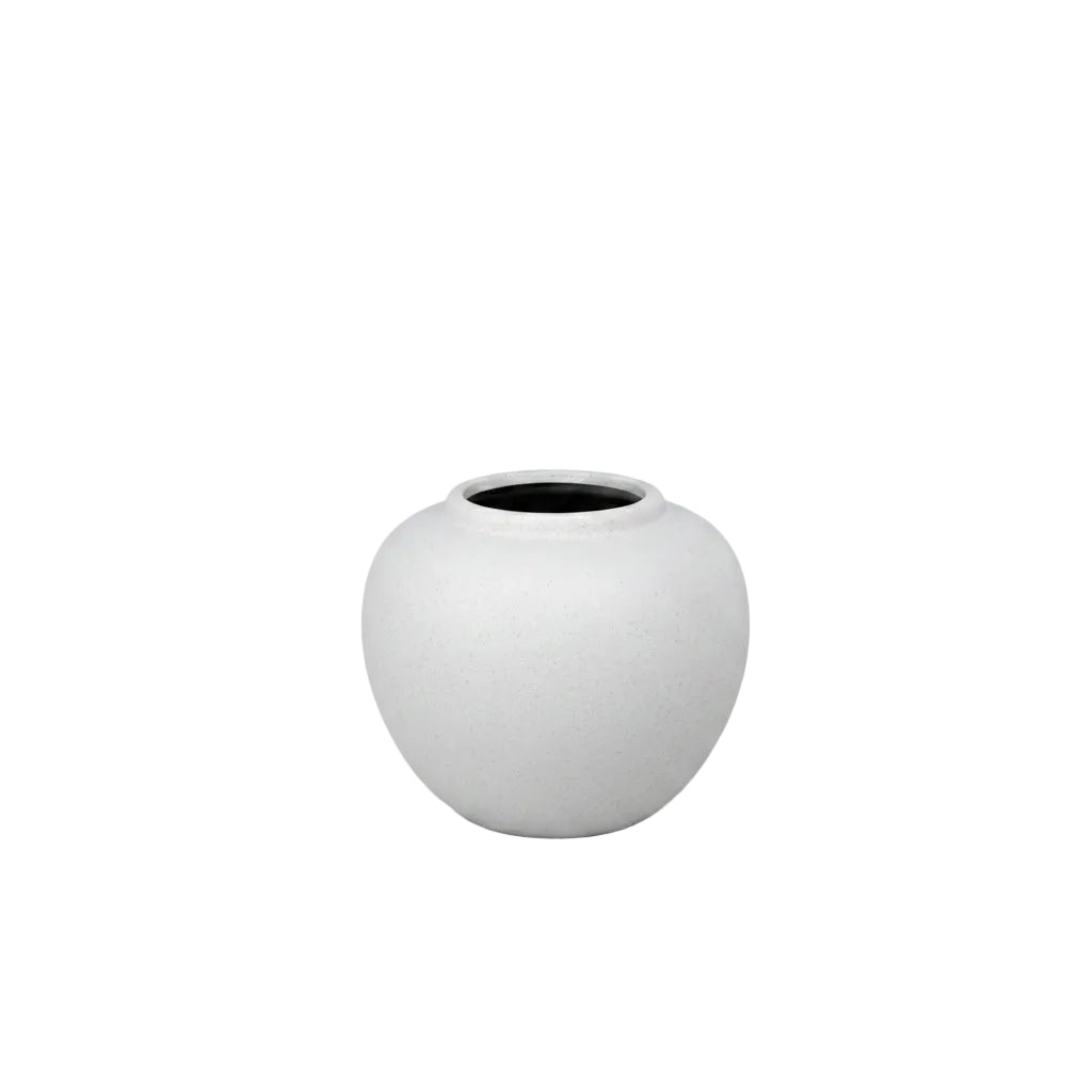 White ceramic vase on a black background