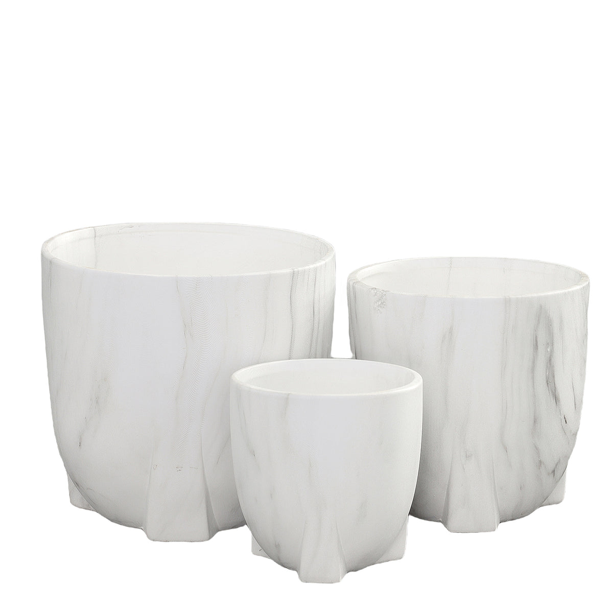 Set of three white marble planters on a white background