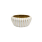 White ceramic bowl with gold stripes on a white background