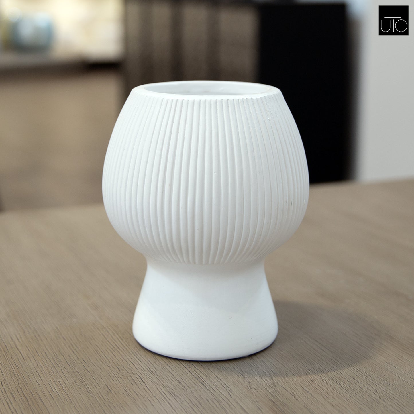 Zoryana Sculpted Stoneware Pot with Pedestal Base