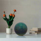 Greenish-blue sphere on a white background
