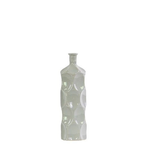 A tall, narrow white ceramic vase with a textured, dimpled surface and a short neck, centered against a solid white background.