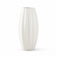 A tall, ribbed ceramic vase in a glossy white finish, centered on a clean white background.