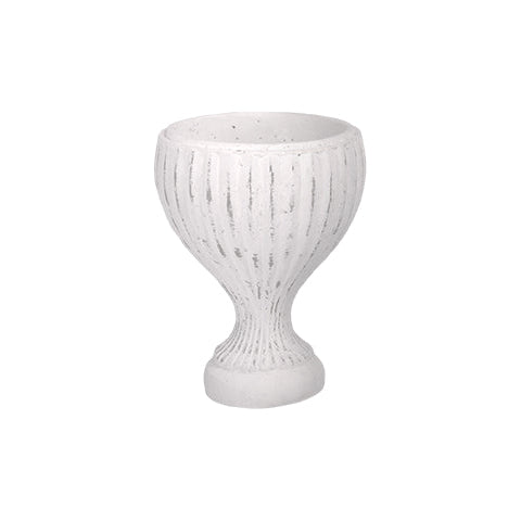 A white textured ceramic planter pot with a ribbed vertical pattern and a flared base, shown against a plain white background.