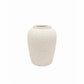 A small textured ceramic vase in a warm off-white or cream color, centered on a solid white background.