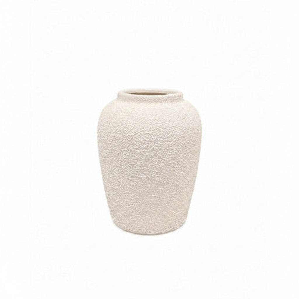A small textured ceramic vase in a warm off-white or cream color, centered on a solid white background.