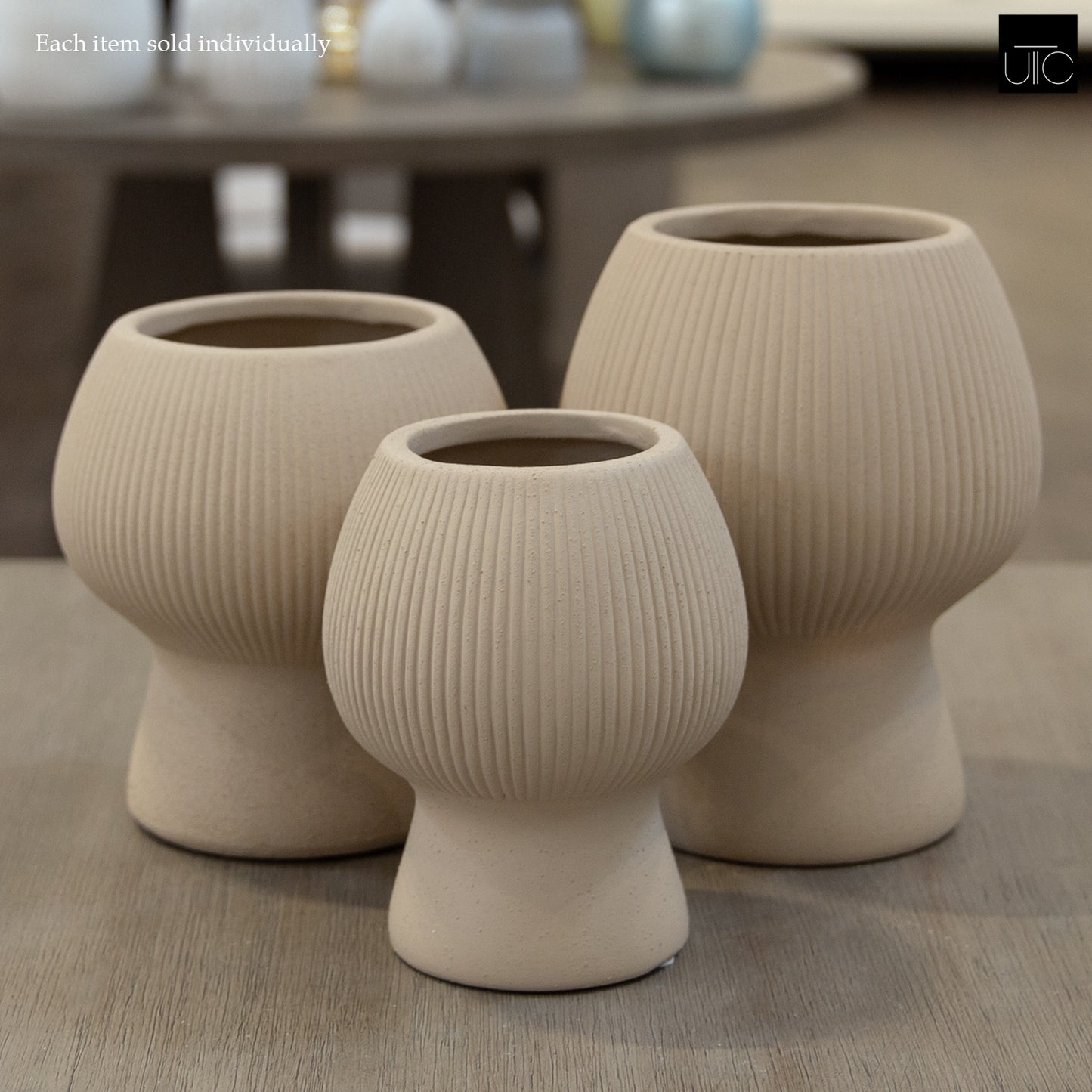 Zoryana Sculpted Stoneware Pot with Pedestal Base