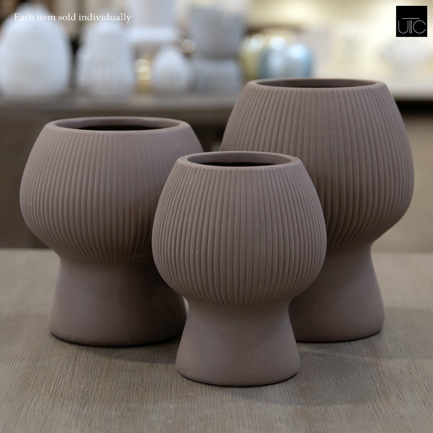 Zoryana Sculpted Stoneware Pot with Pedestal Base