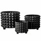 A set of three black ceramic round pots with embossed geometric pyramidal patterns.