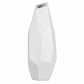 A modern white ceramic vase with a faceted, geometric design and a narrow, tapered opening at the top, shown against a plain white background.