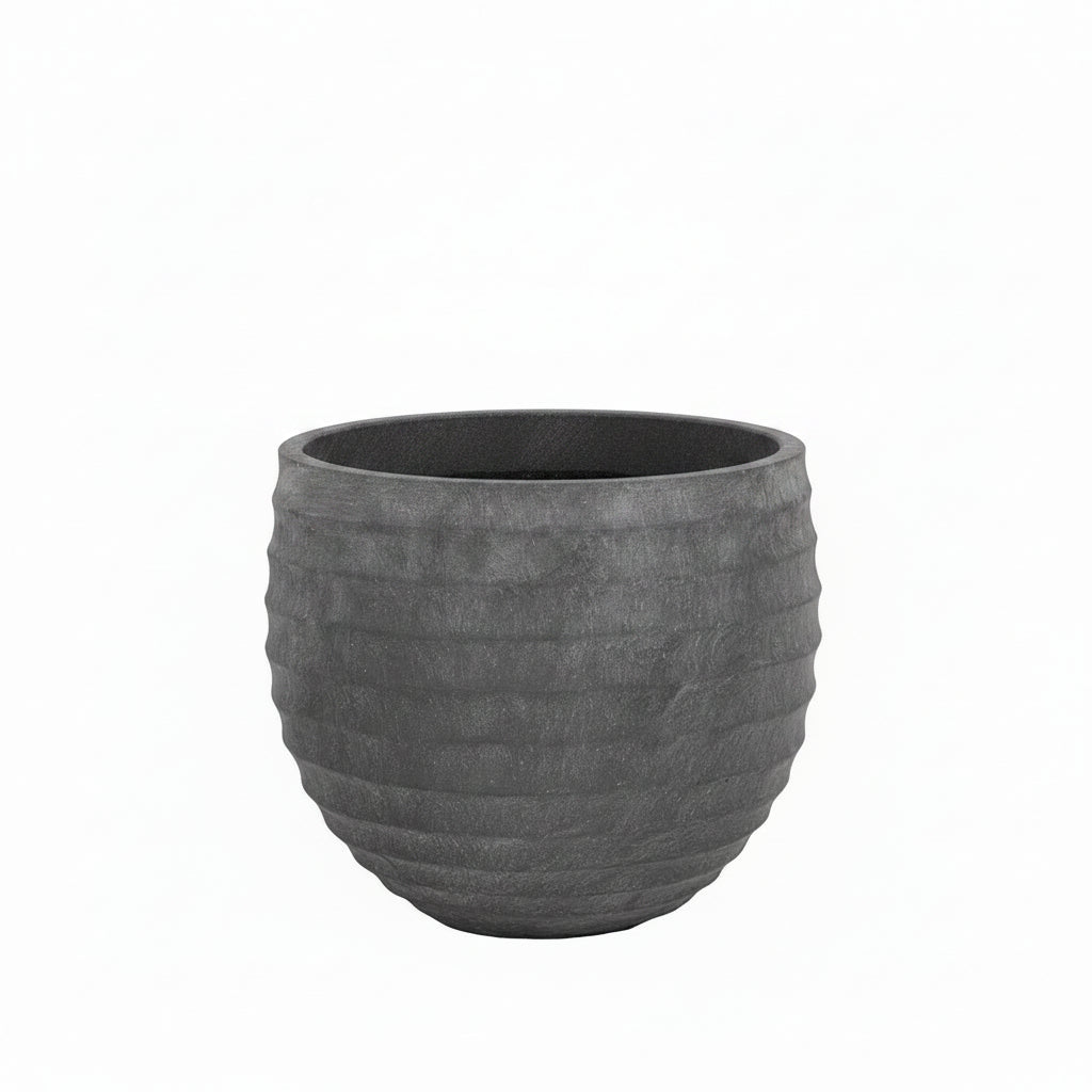 A dark gray textured planter pot with a ribbed, honeycomb-like exterior design, shown against a plain white background.