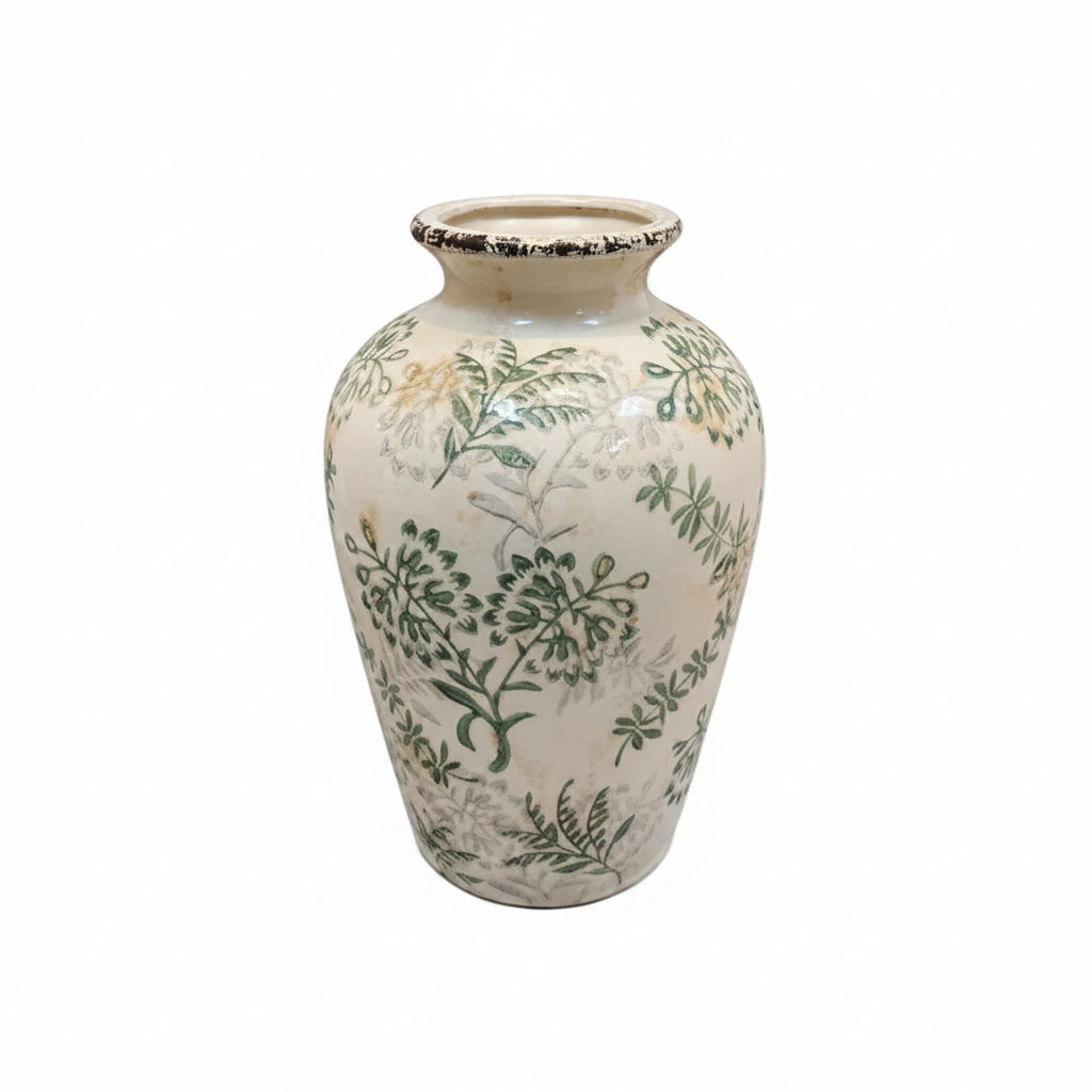 A vintage ceramic vase with a cream-colored glaze, decorated with green botanical patterns and a small yellow accent, set against a plain white background.