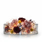 Glass container with flowers and lights on a white background