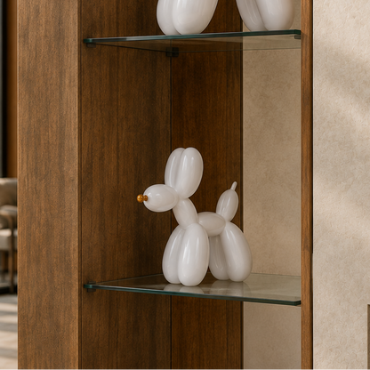 A white balloon-bubble dog sculpture displayed on a glass shelf inside a wooden cabinet, with a beige textured wall in the background.