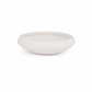 A minimalist, shallow oval ceramic bowl in a matte off-white finish, photographed against a seamless white background.