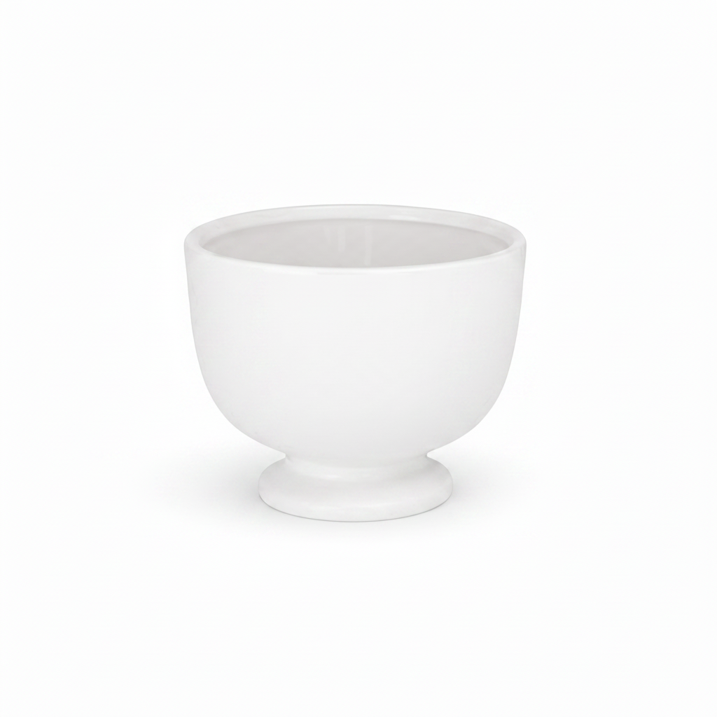 A white ceramic bowl with a flared pedestal base, shown against a plain white background.